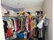 Full walk-in closet with extensive shelving and rod space at 4256 Village Square Ln, Stone Mountain, GA 30083