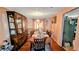 Traditional dining room boasts wood table, chairs, and china cabinet for an elegant dining experience at 4256 Village Square Ln, Stone Mountain, GA 30083