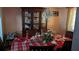 Formal dining room featuring classic furniture, chandelier, and decorative china cabinet at 4256 Village Square Ln, Stone Mountain, GA 30083