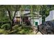 Charming two-story home with siding, brick accents, and an attached one-car garage at 4256 Village Square Ln, Stone Mountain, GA 30083