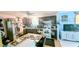 Functional kitchen with stainless steel fridge, dark cabinetry, and eat-in area at 4256 Village Square Ln, Stone Mountain, GA 30083