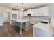 Well-lit kitchen with white cabinets, a large center island, and stainless steel appliances at 632 Eagles Nest Cir, Auburn, GA 30011