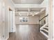 Open-concept living room features coffered ceilings, hardwood floors, and a staircase with iron spindles at 632 Eagles Nest Cir, Auburn, GA 30011