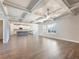 Open-concept living room showcases coffered ceilings and seamless flow to the modern kitchen at 632 Eagles Nest Cir, Auburn, GA 30011