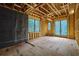 Bedroom with wood framing and a series of large windows bringing in lots of natural light at 120 Wood River Ct, Johns Creek, GA 30097