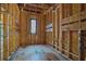 Unfinished bedroom with ample space and a window, awaiting personalized design and comfort at 120 Wood River Ct, Johns Creek, GA 30097