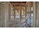 Hallway under construction showing framing, plumbing and electrical features at 120 Wood River Ct, Johns Creek, GA 30097