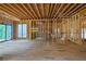 Unfinished interior with large windows and an open layout, ready for customization at 120 Wood River Ct, Johns Creek, GA 30097