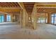 Spacious interior showcasing the home's layout with natural light and unfinished design at 120 Wood River Ct, Johns Creek, GA 30097