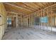 Interior view of framing showcasing open floor plan, wood supports, and visible utilities at 120 Wood River Ct, Johns Creek, GA 30097