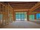 Large, unfinished living room with sliding doors, perfect for entertaining and relaxation at 120 Wood River Ct, Johns Creek, GA 30097