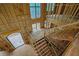 An overhead view of the unfinished staircase, entry and exposed wood framing at 120 Wood River Ct, Johns Creek, GA 30097