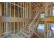 Wood staircase under construction, showing framing and placement in home at 120 Wood River Ct, Johns Creek, GA 30097