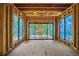 Unfinished sunroom with large windows and sliding doors, perfect for indoor/outdoor living at 120 Wood River Ct, Johns Creek, GA 30097