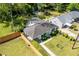 Aerial view of a well-maintained property with a landscaped yard, fenced boundaries, and a charming home at 1421 Smith Se St, Atlanta, GA 30316