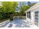 Spacious backyard deck ideal for outdoor entertaining, featuring a white railing and bench at 1421 Smith Se St, Atlanta, GA 30316