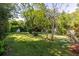 The backyard is spacious and grassy with several trees and bushes at 1421 Smith Se St, Atlanta, GA 30316
