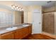 Bathroom with double sink vanity, shower, wooden floor and a closet at 1421 Smith Se St, Atlanta, GA 30316