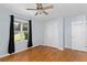 This bedroom has hardwood floors, a ceiling fan, and natural light from the window at 1421 Smith Se St, Atlanta, GA 30316