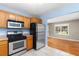 This kitchen features wooden cabinets and stainless steel appliances at 1421 Smith Se St, Atlanta, GA 30316