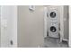 A well-lit laundry room features a stacked washer and dryer at 1421 Smith Se St, Atlanta, GA 30316