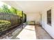 Covered patio with concrete flooring, offering a shaded outdoor space with a view of the garden at 1421 Smith Se St, Atlanta, GA 30316