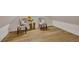 Finished attic space with hardwood floors, two chairs, sunflower decor, and natural light at 247 Terrace View Dr, Acworth, GA 30101