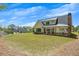 Expansive backyard view featuring a covered patio and ample yard space, perfect for outdoor living at 247 Terrace View Dr, Acworth, GA 30101