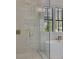Bright bathroom with a soaking tub, large windows with shutters, glass enclosed shower, and high-end gold fixtures at 247 Terrace View Dr, Acworth, GA 30101