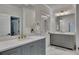 Elegant bathroom featuring double vanities, grey cabinetry, white countertops, and modern fixtures at 247 Terrace View Dr, Acworth, GA 30101