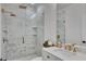Beautiful bathroom with a marbled glass shower, marble tiled floor, and gold fixtures at 247 Terrace View Dr, Acworth, GA 30101