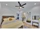 Bright bedroom with ceiling fan, plush bedding, and a view into another room with vanity at 247 Terrace View Dr, Acworth, GA 30101
