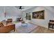 Finished bonus room with hardwood floors, comfortable seating, and a large historical art piece at 247 Terrace View Dr, Acworth, GA 30101
