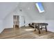Finished bonus room with a foosball table, skylights, and hardwood floors at 247 Terrace View Dr, Acworth, GA 30101