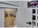 View into closet with a chair, clothing on racks and shelves, and hardwood floors in an alcove at 247 Terrace View Dr, Acworth, GA 30101