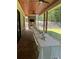 Outdoor dining area on covered patio with long table, seating, and backyard views at 247 Terrace View Dr, Acworth, GA 30101