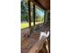 Elegantly set dining table on a covered patio with outdoor views, perfect for entertaining guests at 247 Terrace View Dr, Acworth, GA 30101