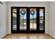 Elegant entryway showcasing double doors adorned with wreaths and hardwood floors at 247 Terrace View Dr, Acworth, GA 30101