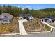 New construction home with a stylish black and white exterior and long driveway landscaped with new plantings at 247 Terrace View Dr, Acworth, GA 30101