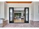Grand foyer with double doors leading into a spacious living room and hardwood floors at 247 Terrace View Dr, Acworth, GA 30101