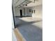 Spacious two car garage featuring a sealed concrete floor, a black door, and room for storage at 247 Terrace View Dr, Acworth, GA 30101