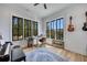 Sunlit home office with large windows, piano, guitars, desk, and calming view, perfect for work or creative hobbies at 247 Terrace View Dr, Acworth, GA 30101