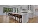 Bright kitchen boasts a center island with seating, modern appliances, and natural light at 247 Terrace View Dr, Acworth, GA 30101