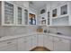 Well-lit kitchen boasts white cabinets, quartz countertops, and stainless steel appliances at 247 Terrace View Dr, Acworth, GA 30101