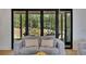 Inviting living area with large glass doors, seamlessly blending indoor comfort with outdoor views of the lush backyard at 247 Terrace View Dr, Acworth, GA 30101