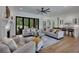 Bright, open living room with fireplace, access to outdoor space, and adjacent to the kitchen at 247 Terrace View Dr, Acworth, GA 30101