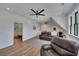 Spacious living room with hard wood floors, ceiling fans, and large windows offering lots of natural light at 247 Terrace View Dr, Acworth, GA 30101