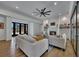 Bright living room with fireplace, built-in shelving, hardwood floors, modern lighting and double doors to the exterior at 247 Terrace View Dr, Acworth, GA 30101