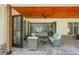 Charming outdoor patio with brick flooring, stylish furniture, and serene views through the open glass doors at 247 Terrace View Dr, Acworth, GA 30101