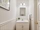 Bathroom featuring a white vanity with brushed brass hardware and board and batten detail at 370 Landing Entry, Johns Creek, GA 30022